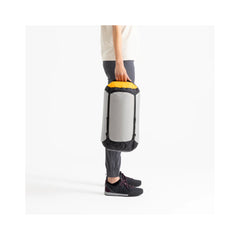 High Rise / 20L | Sea To Summit Evac Ultra-Light Compression Dry Bag Image Showing A Male Model Carrying The Dry Bag.