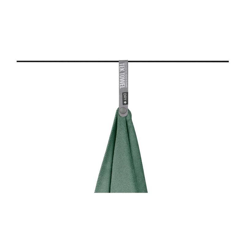 Sage Green | Sea To Summit Trek Towel Image Showing Towel Hanging Up To Dry After Being Wrung Out.
