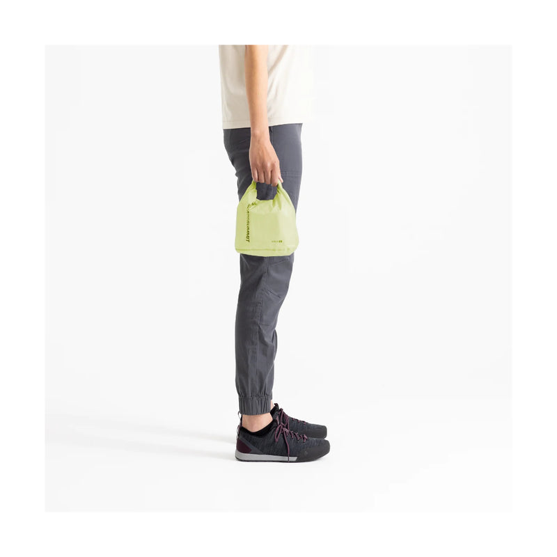 Tarragon | Sea To Summit Ultra Sil Dry Bag Image Showing The Dry Bag Being Carried, By The Handle.