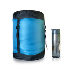 Blue | Sherpa Pemba -10 Sleeping Bag Image Showing Sleeping Bag In Compression Sack Next To A Water Bottle.