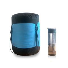 Blue | Sherpa Pemba -5 Sleeping Bag Image Showing Sleeping Bag In Compression Sack, Next To A Water Bottle.