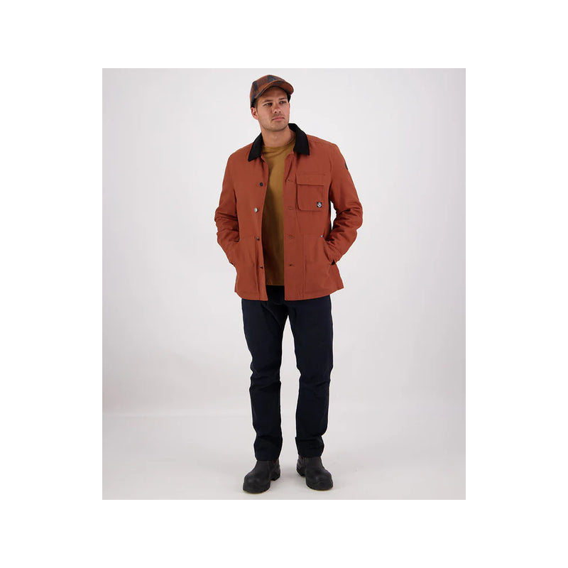 Rusty | Swanndri Barrytown V3 Canvas Jacket Image Showing Zoomed Out View Of The Model Wearing The Jacket, With The Buttons Undone.