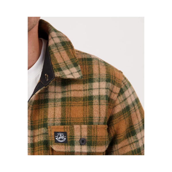 Arizona Check | Swanndri Mens Kiaraki Wool Shacket Image Showing Shacket On A Model Close Up Of The Collar, And Logo On The Chest Pocket.