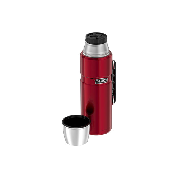 Red / 2L | Thermos Vacuum Insulated Stainless Steel Thermos Image Showing  Angled Front View, With Cap Off.