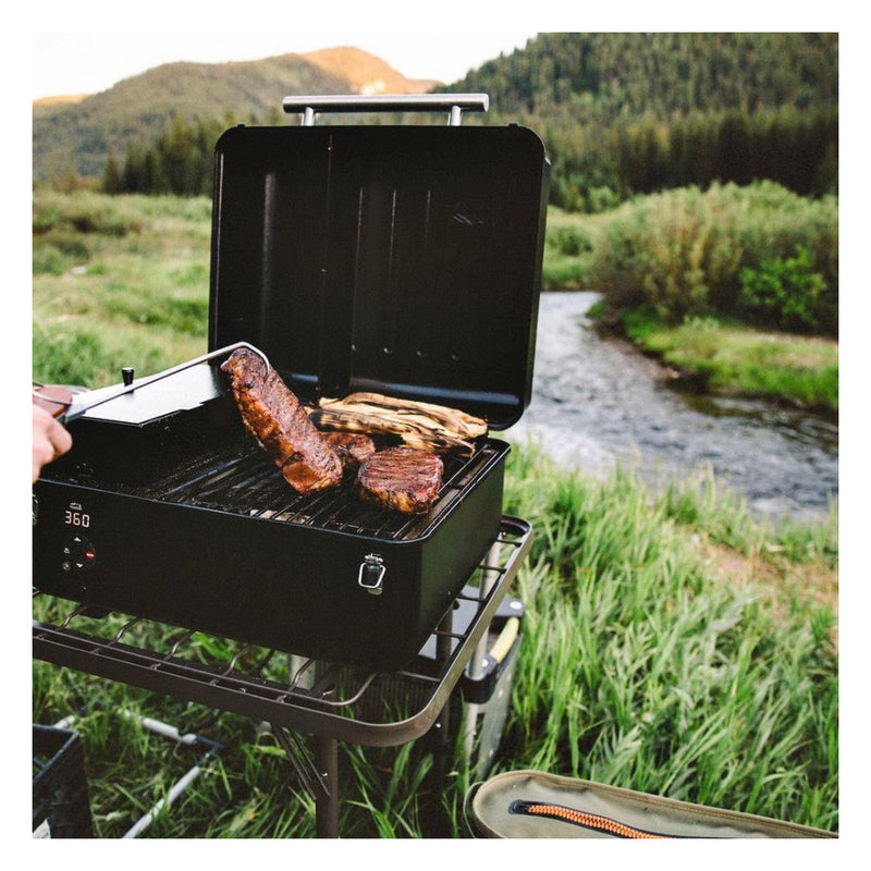 Traeger Ranger Portable Pellet Grill. Front View, Showing In Use Beside River. 