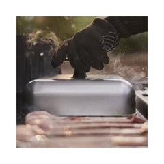 Stainless Steel | Weber Basting Dome Image Showing The Dome Being Removed From The Hot Plate, After Cooking Food.