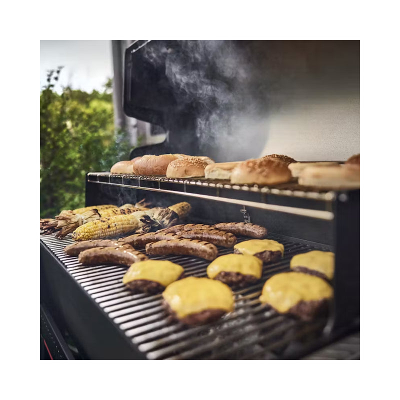 Black | Weber Searwood XL 600 Pellet BBQ Image Showoing Angled Side View Of Food Being Cooked.