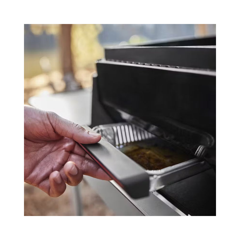 Black | Weber Slate Tabletop Griddle 17'' Image Showing Close Up View Of The Drip Tray Being Pulled Out.