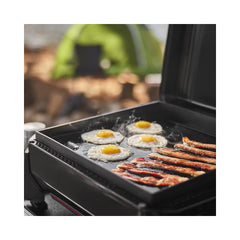 Black | Weber Slate Tabletop Griddle 17'' Image Showing Close Up View Of The BBQ Cooking Bacon And Eggs.