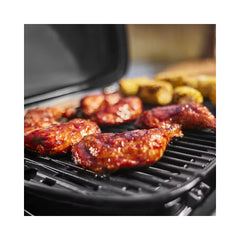 Black | Weber Traveler Compact Portable Gas BBQ Image Showing Close Up View Of The Grill, Cooking Food.