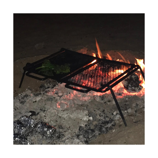 58 x 46.5 | Wildtrak Flat Plate And Grill FIH Camp Cooker Image Showing The Cooker Over A Fire.