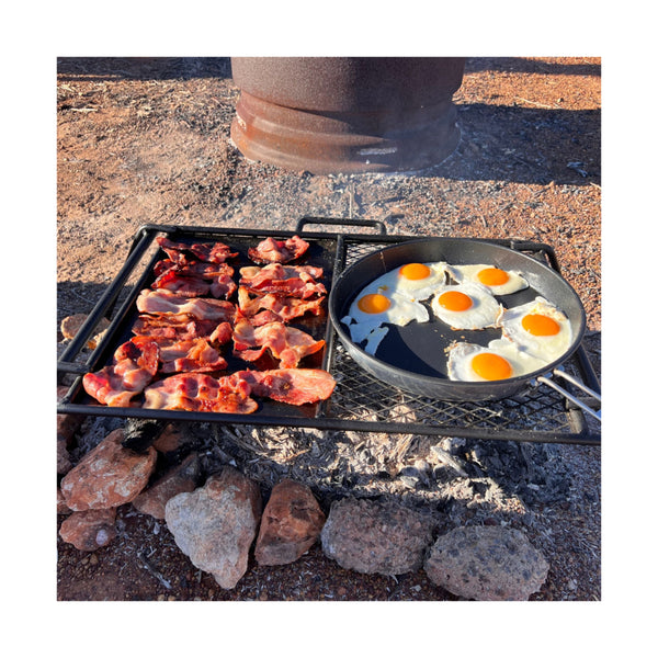 65 x 42.5 | Wildtrak Flat Plate And Grill Camp Cooker Large Image Showing Food Cooking On The Plate.