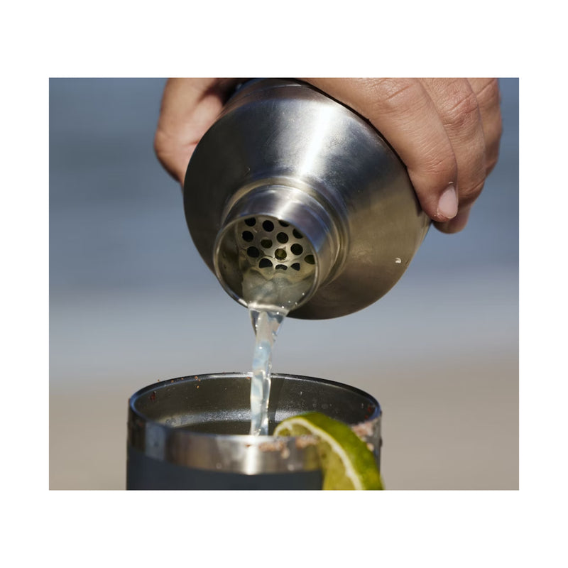 Stainless Steel | YETI Rambler  Cocktail Shaker Lid Image Showing A Drink Being Poured Out Of The Shaker Lid.