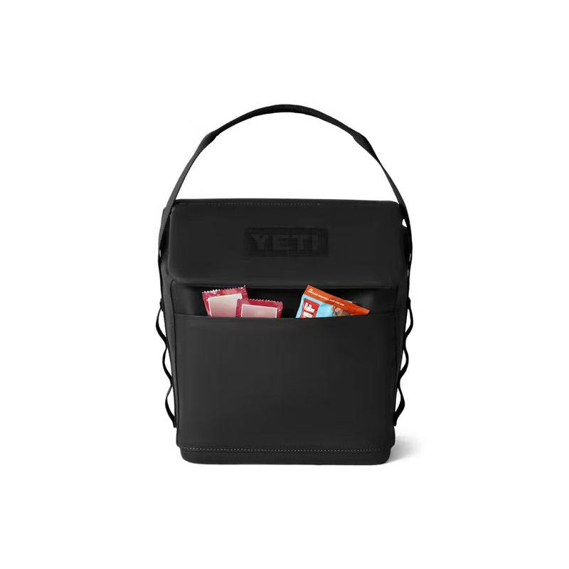 Black / 6L | YETI Daytrip Insulated Lunch Bag Image Showing Front View With Snacks In The Front Zippered Pocket