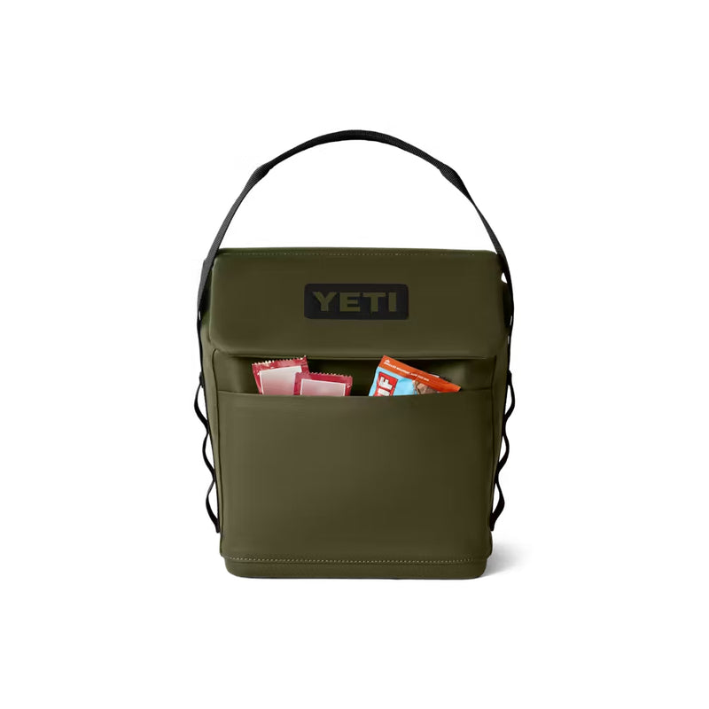Olive / 6L | YETI Daytrip Insulated Lunch Bag Image Showing Front View With Snacks In The Front Zippered Pocket.