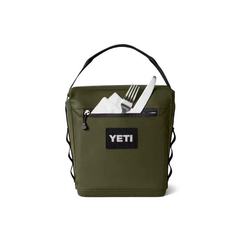 Olive / 6L | YETI Daytrip Insulated Lunch Bag Image Showing Back View Zippered Pocket Full Of Utensils, Handle Up.