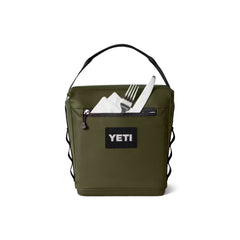 Olive / 6L | YETI Daytrip Insulated Lunch Bag Image Showing Back View Zippered Pocket Full Of Utensils, Handle Up.