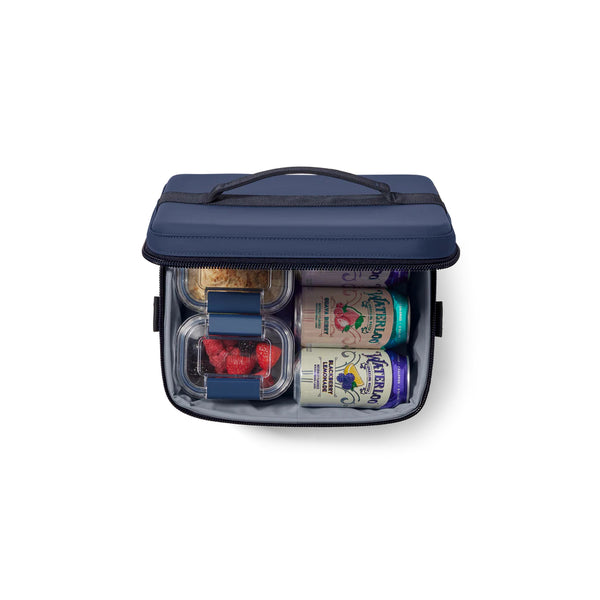 Navy | YETI Daytrip Insulated Snack Box 9L Image Showing Top View, Lid Open Packed With Food And Cans.