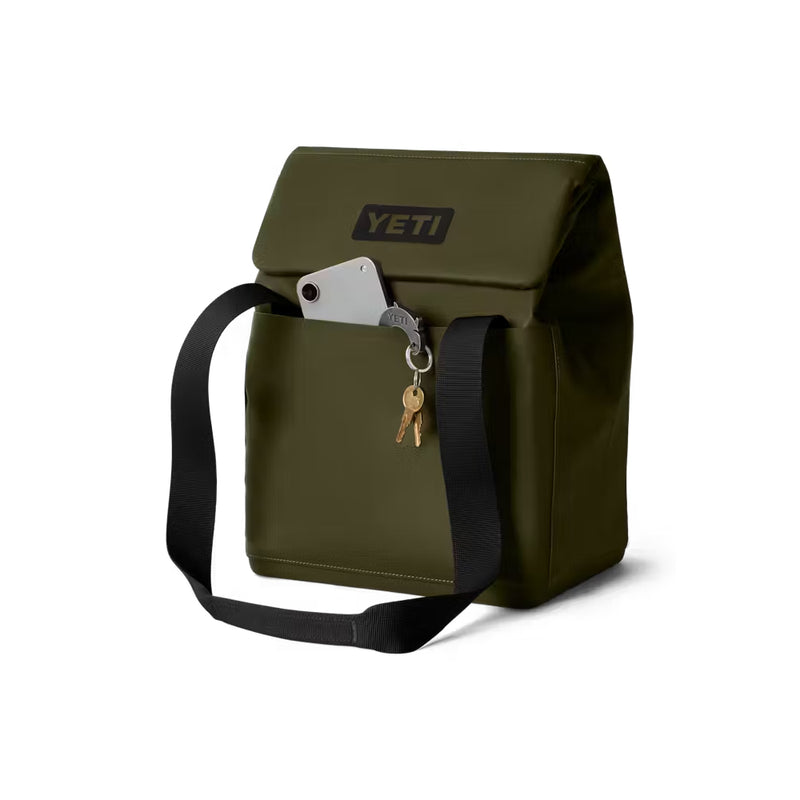 Olive / 14L | YETI Daytrip Insulated Tote Bag Image Showing Angled Front View, Handles Down, Closed With The Front MagSnap Pocket Being Used As Storage For Keys And Phone.