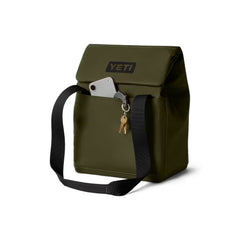 Olive / 14L | YETI Daytrip Insulated Tote Bag Image Showing Angled Front View, Handles Down, Closed With The Front MagSnap Pocket Being Used As Storage For Keys And Phone.
