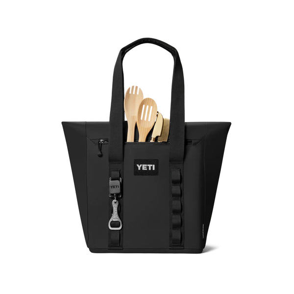 Black | YETI Daytrip Insulated Tote Bag Image Showing Back View, With Pockets Being Used.