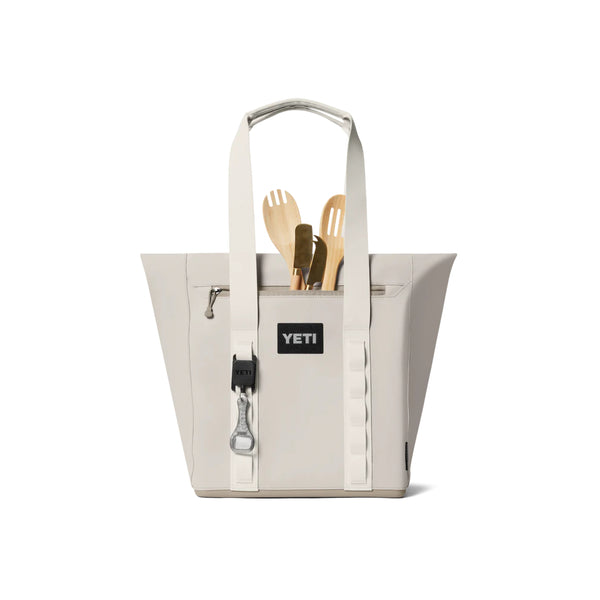 Cape Taupe | YETI Daytrip Insulated 20L Tote Bag Image Showing Back View, With Pocket In Use.