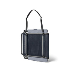 Navy | YETI Hondo Beach Chair Image Showing Angle View Of The Beach Chair Folded Up With Carry Strap.
