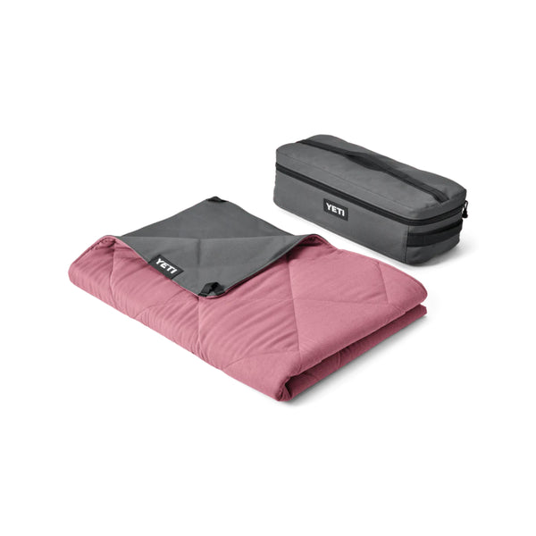 Fireside Red | YETI Lowlands Blanket. Shown Folded up Next to Storage Bag. 