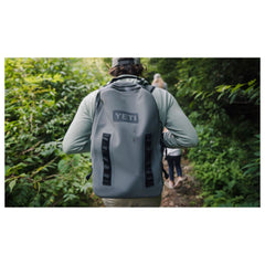 Charcoal | YETI Panga Submersible Backpack - 28L. Shown on Model While Hiking.