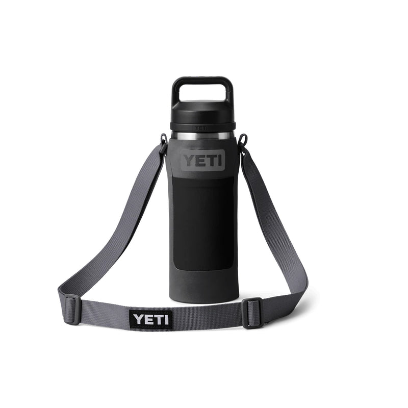 Charcoal | YETI Rambler Bottle Sling Small Image Showing 18oz Bottle In Sling, Strap Down With YETI Logos In View.