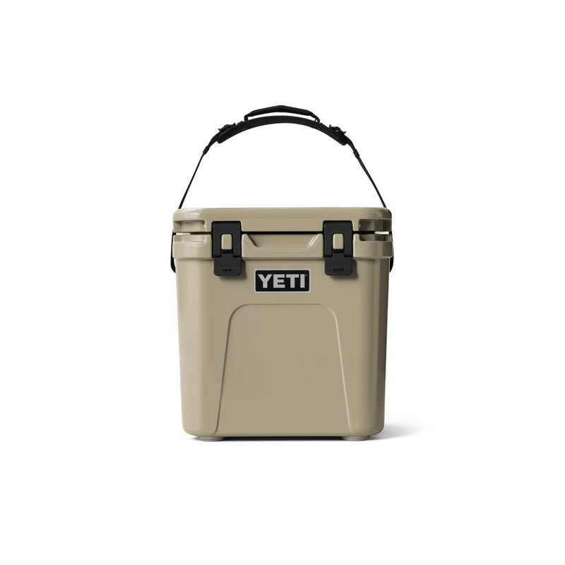 Tan | YETI Roadie 24 Hard Cooler 2.0 Image Showing Front View With The Handle Up.
