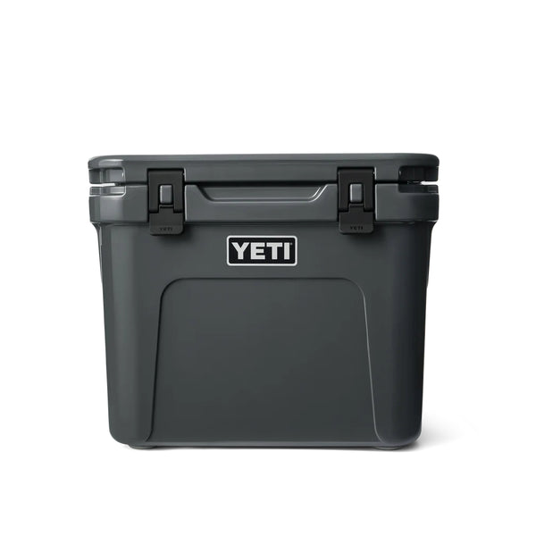 Charcoal | YETI Roadie 32 Wheeled Hard Cooler Image Showing Front View, Handle Down.