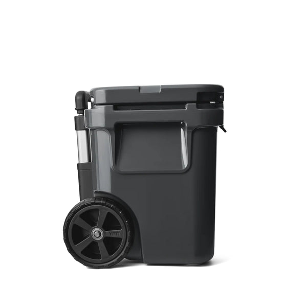 Charcoal | YETI Roadie 32 Wheeled Hard Cooler Image Showing Side View, Handle Down.