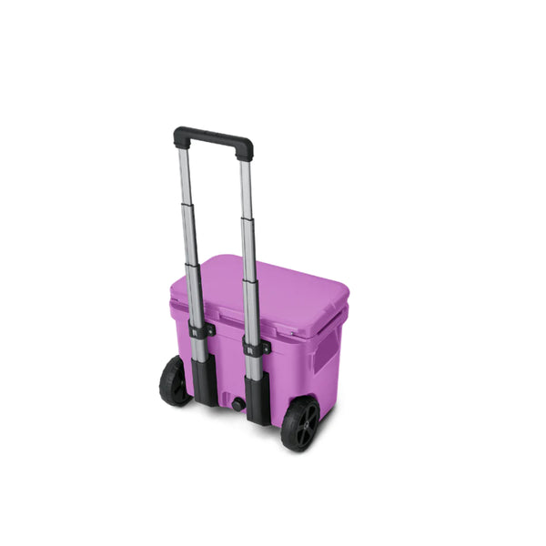 Desert Bloom | YETI Roadie 32 Wheeled  Hard Cooler Image Showing Back View, Lid Closed And Handle Up.