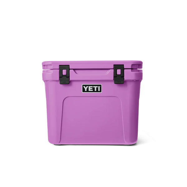 Desert Bloom | YETI Roadie 32 Wheeled Hard Cooler Image Showing Front View, Handle And Lid Down.