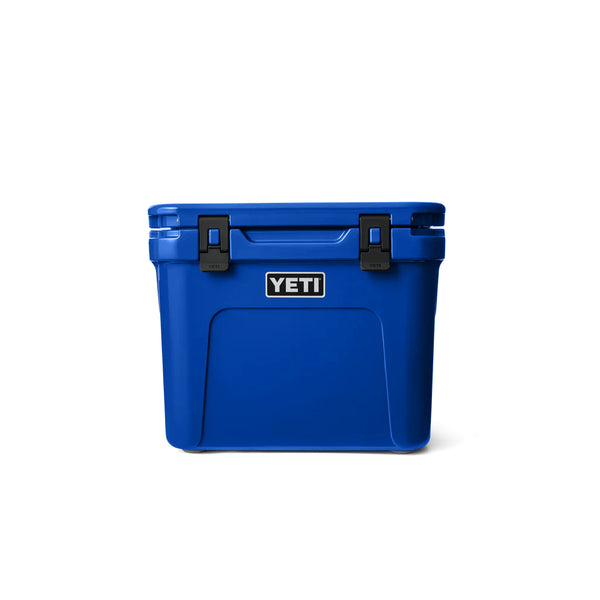 Royal Blue | YETI Roadie 32 Wheeled Hard Cooler Image Showing Front View, Lid And Handle Down