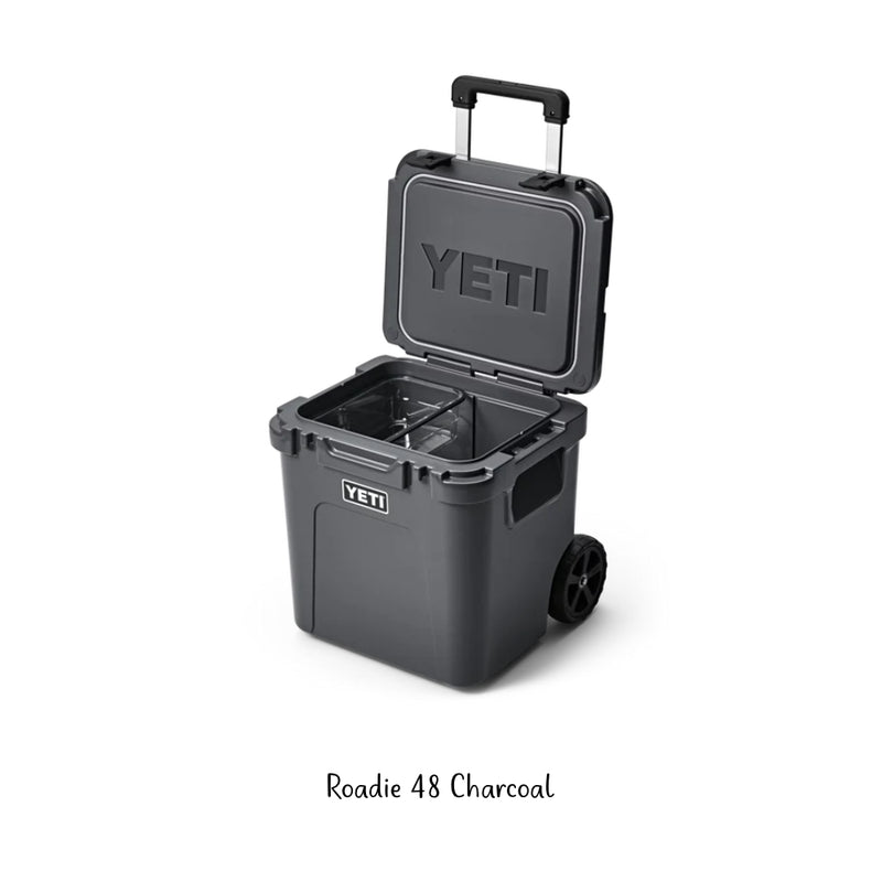 Charcoal | YETI Roadie 48 Hard Cooler Image Showing Angled Front View, Lid And Handle Up.