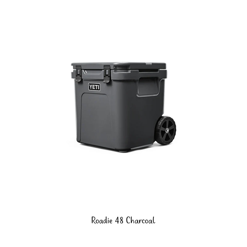  Charcoal | YETI Roadie 48 Hard Cooler Image Showing Angled Side View Lid Closed, Handle Down. 