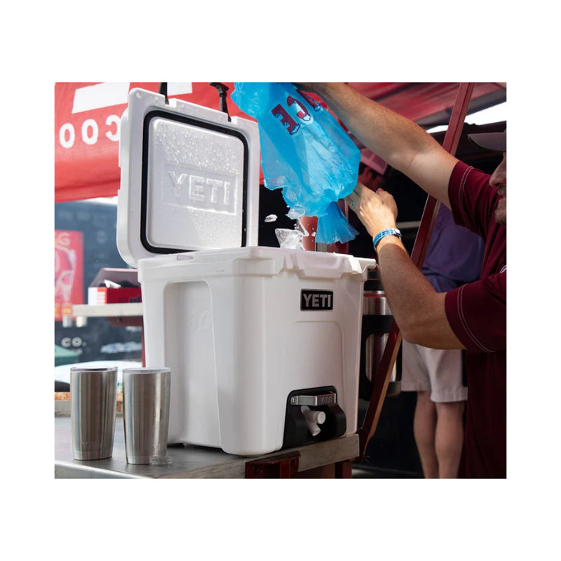 White | YETI Silo 22.7 Litre Water Cooler With Tap image Showing Lid Open Ice Being Poured In.