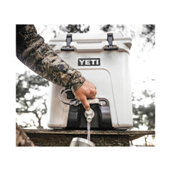 White | YETI Silo 22.7 Water Cooler With Tap Image Showing Close Up Of Tap Water Being Poured Out.