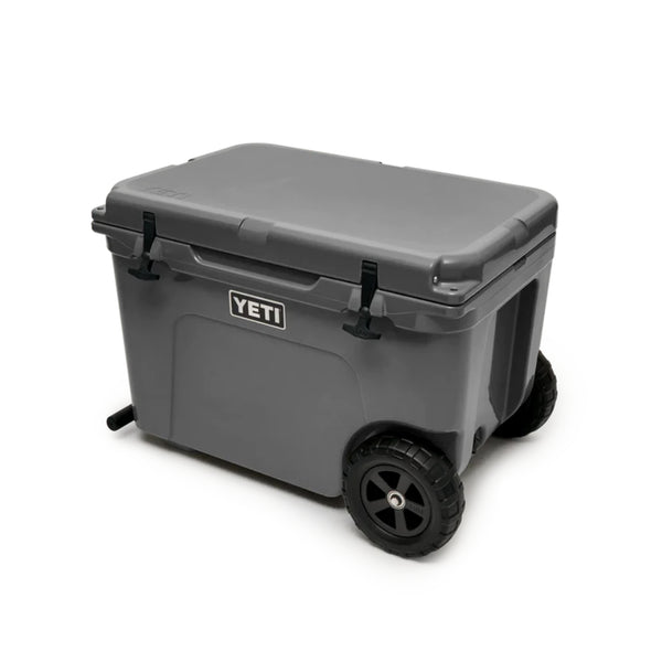Charcoal | YETI Tundra Wheeled Hard Cooler Image Showing Angled Front View, Lid Closed.
