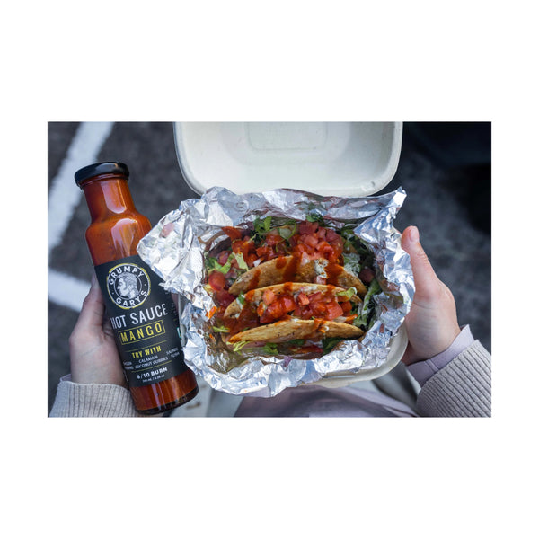 245ml | Grumpy Gary's Hot Sauce - Mango Image Showing The Hot Sauce Used On Top Of Street Tacos.