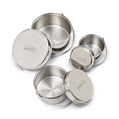 Stainless Steel | All pots with lids leaning against the side