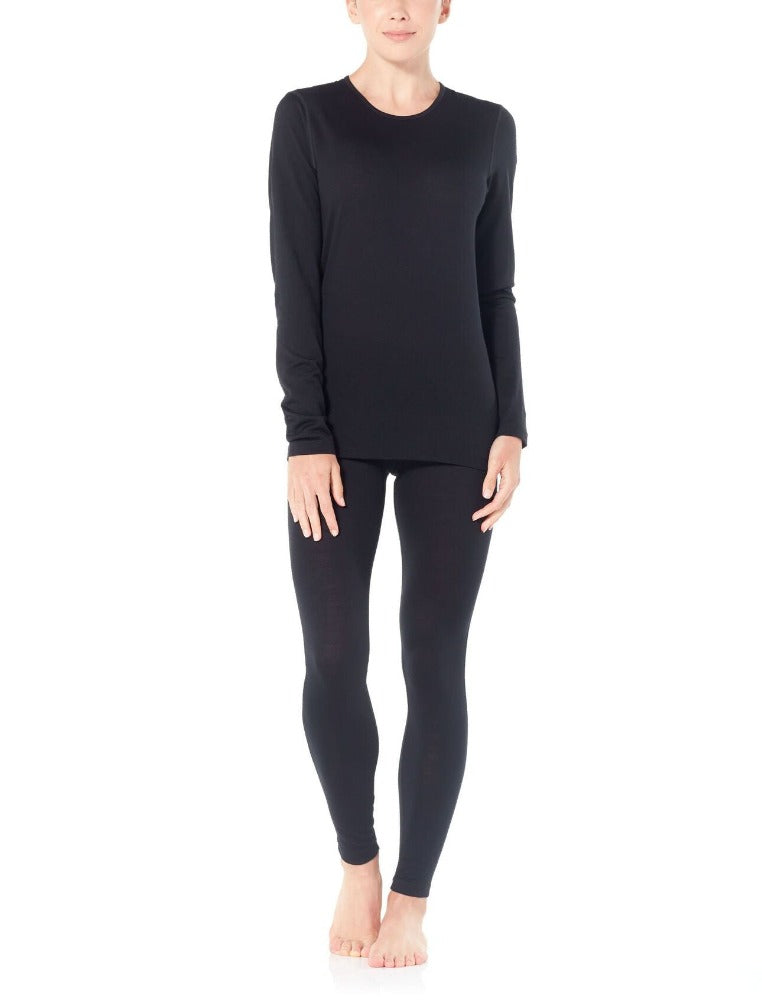 Black | Icebreaker Women's 200 Oasis Thermal Long Sleeve Crewe. Modelled Full Body Front View With Leggings to Match.