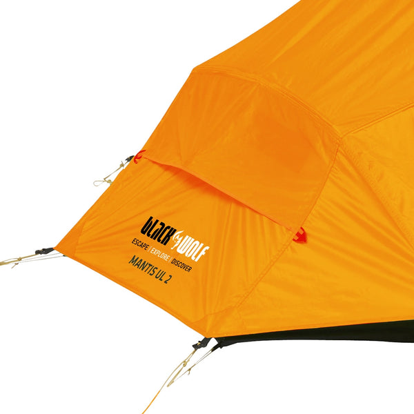 Orange | Close up of fly foot showing black wolf logo
