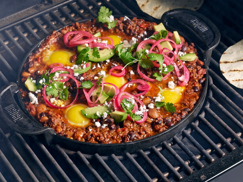 In use cooking a mince dish cooing pot/dish on grill.