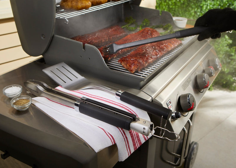 Stainless Steel | Basing brush being used on ribs with other tools on side table