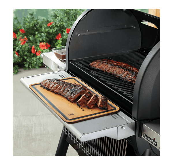 Lifestyle image of cutting board being used on the front table of the SmokeFire BBQ