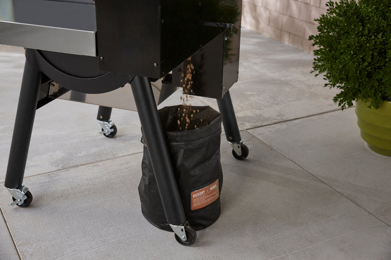 Bag under SmokeFire BBQ catching pellets as they are released