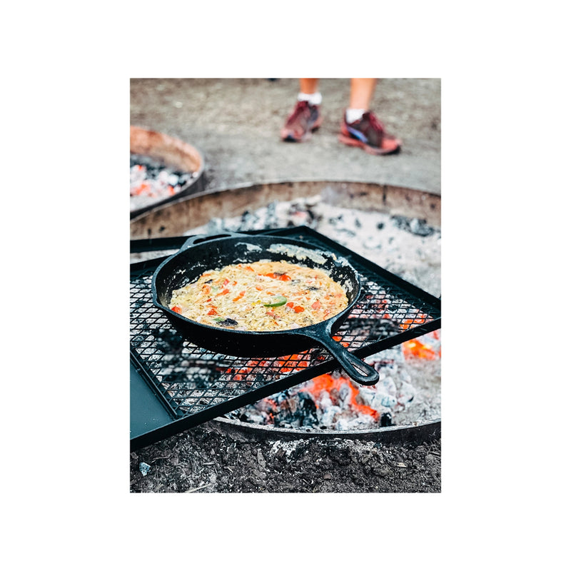 Cooking Risotto in Skillet Over Campfire.
